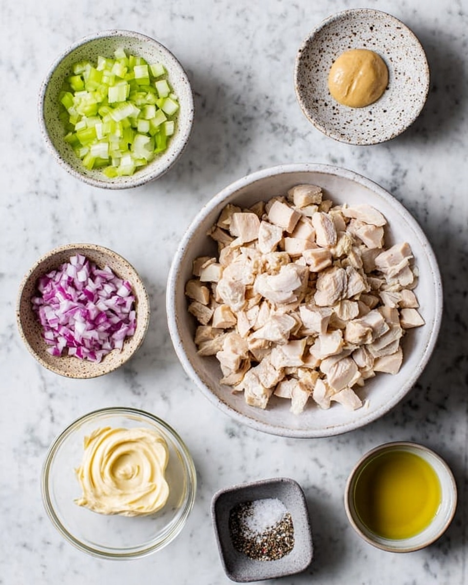 The image shows six bowls with different ingredients on a white marbled surface. In the middle, there is a large white bowl filled with chopped pale beige chicken pieces. Above it to the left is a small white bowl of chopped light green celery. Above it to the right is a small speckled bowl with a dollop of smooth tan mustard. Below the chicken bowl to the left is a small clear bowl of finely chopped reddish-purple red onions. Below the chicken bowl to the right is a small clear bowl filled with creamy pale yellow mayonnaise. At the bottom right corner, there is a small white bowl with yellow olive oil. Below the chicken bowl, a small gray ceramic dish holds coarse white salt and black pepper. Photo taken with an iphone --ar 4:5 --v 7