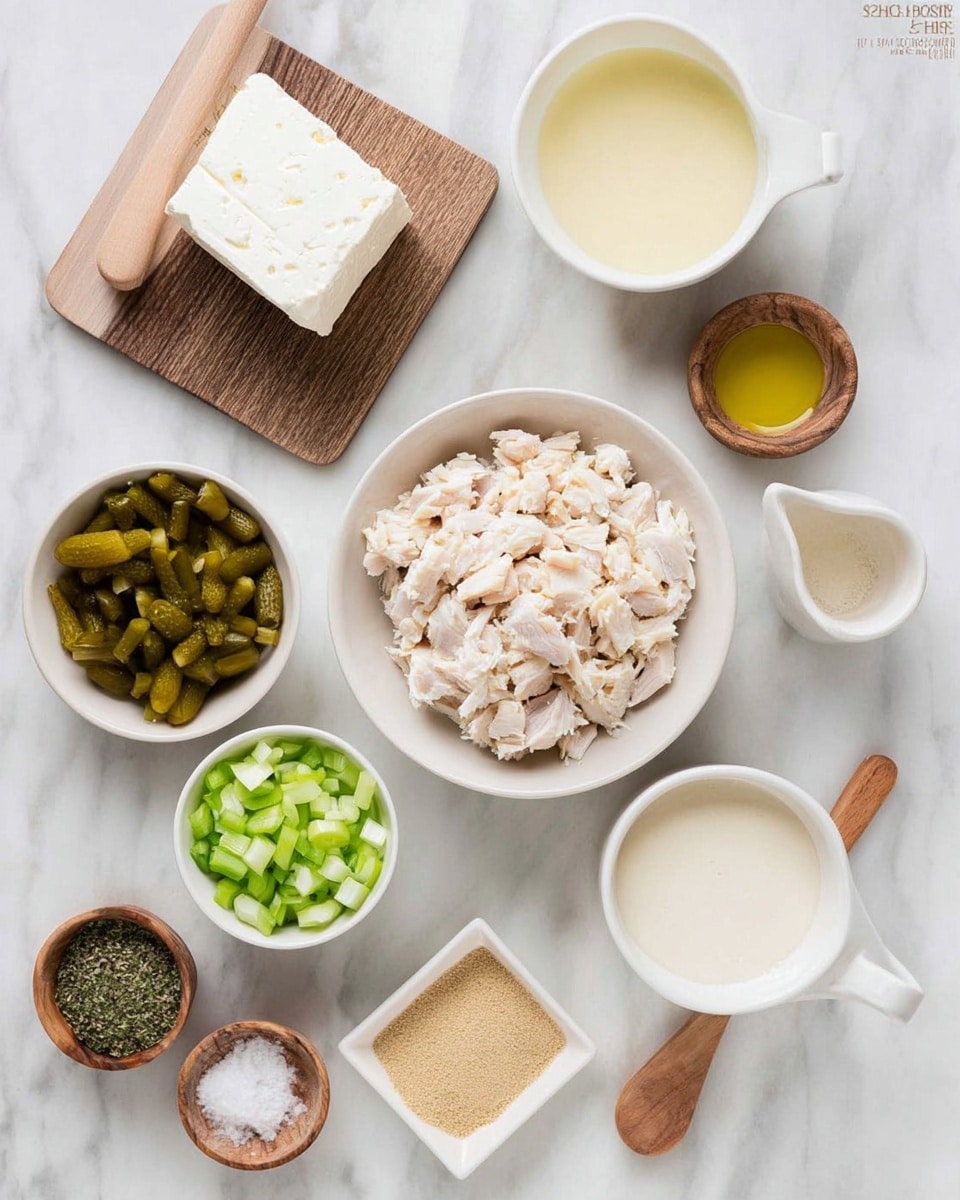 The image shows ingredients neatly arranged on a white marbled surface. In the center, there is a white bowl full of small chopped pieces of pale, cooked chicken. Below it, another white bowl contains diced green pickles, and next to it on the right is a smaller white bowl with chopped green onions. To the left of the chicken bowl, there is a small white dish filled with finely ground green herbs. Above it, a wooden board holds a rectangular block of white cream cheese. To the right of the chicken bowl, a white measuring cup is filled with smooth, light cream, and a small white square dish holds a tan powder, likely garlic or onion powder. Near the top right corner, a wooden container with a lid is open, holding white salt and a small wooden spoon. At the bottom left, a wooden bowl contains a black pepper mix with a wooden spoon inside. In the middle top, there is a small white bowl with a clear pale yellow liquid. Photo taken with an iphone --ar 4:5 --v 7