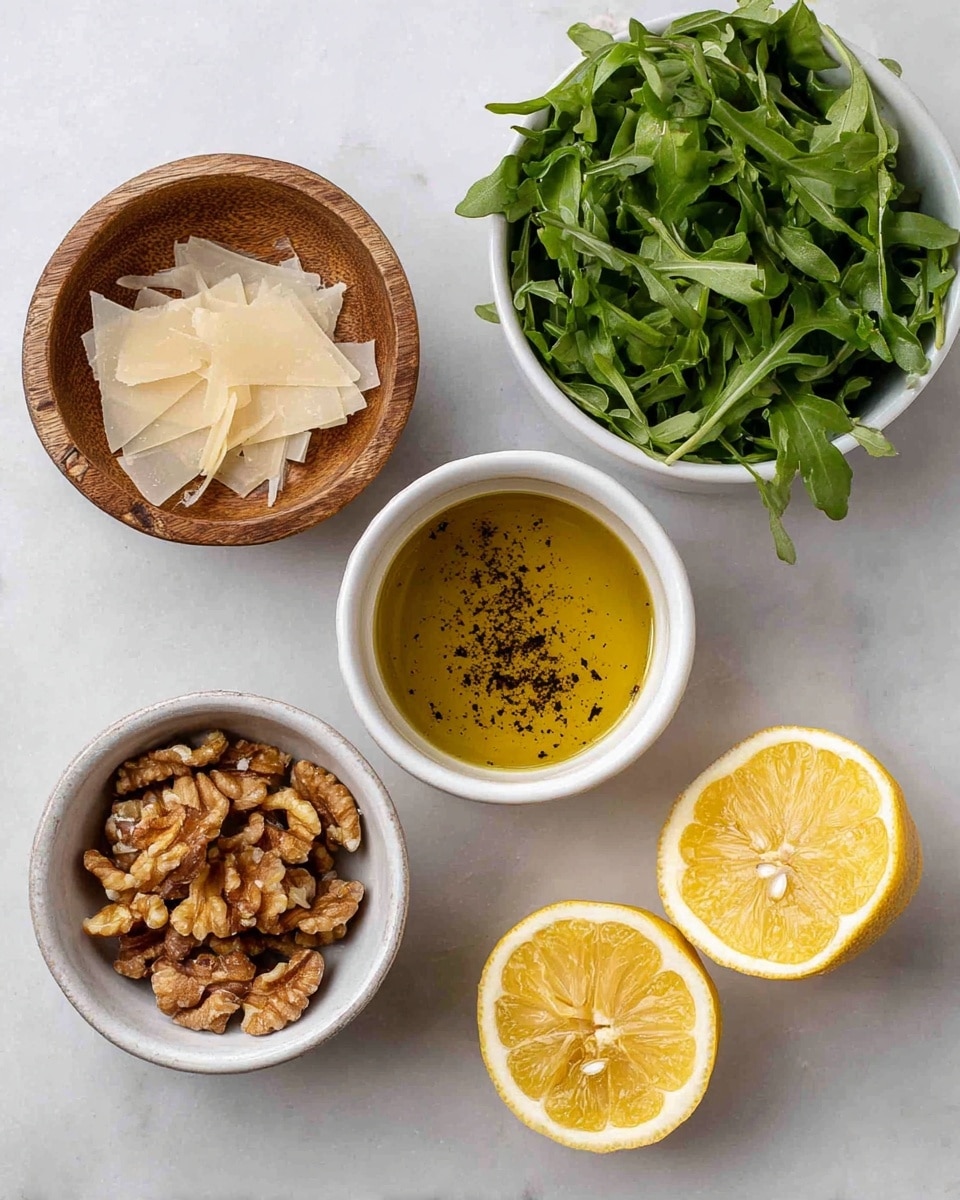 The image shows five main items arranged on a white marbled surface: a small wooden bowl filled with light ivory thin cheese shavings at the top left; a white bowl at the top right filled with fresh green leafy arugula; a white bowl in the center holding golden olive oil with black pepper sprinkled on the surface; a white bowl at the bottom left filled with toasted brown walnut pieces; and two yellow lemon halves with textured, juicy interiors placed on the right side. The items are spaced apart clearly to show details of each ingredient. Photo taken with an iphone --ar 4:5 --v 7