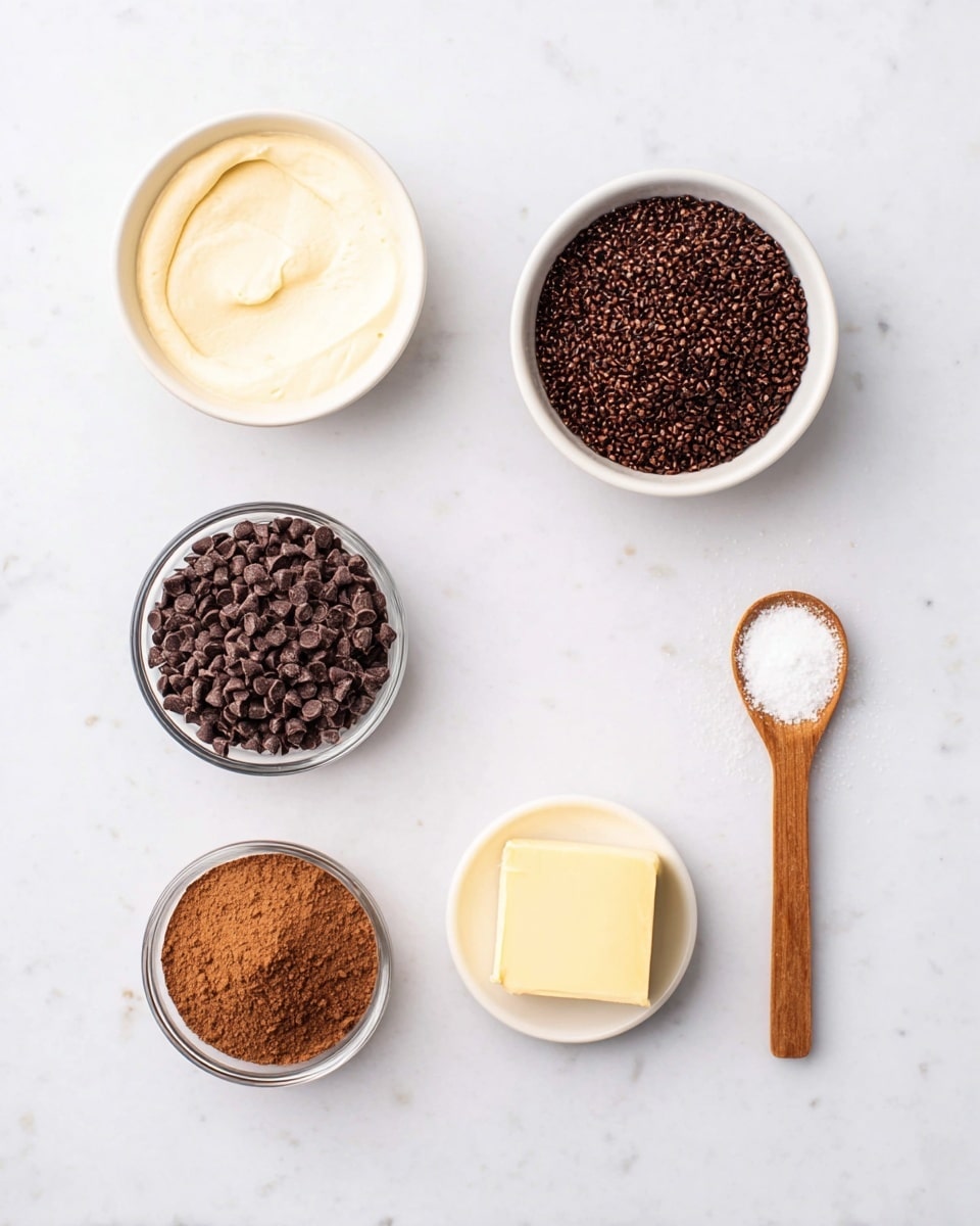 The image shows five small white bowls and one wooden spoon arranged on a white marbled surface. The top left bowl holds a light cream-colored smooth mixture. To the right, there is a bowl filled with many small dark brown chocolate sprinkles. In the middle, a clear bowl contains a pile of fine brown cocoa powder. Below that, another clear bowl is filled with many small dark brown chocolate chips. To the right, a wooden spoon holds a small amount of white granulated sugar. Finally, at the bottom right, a white bowl holds a small square of pale yellow butter. The arrangement is simple and clean, highlighting the different textures and colors of these ingredients. photo taken with an iphone --ar 4:5 --v 7