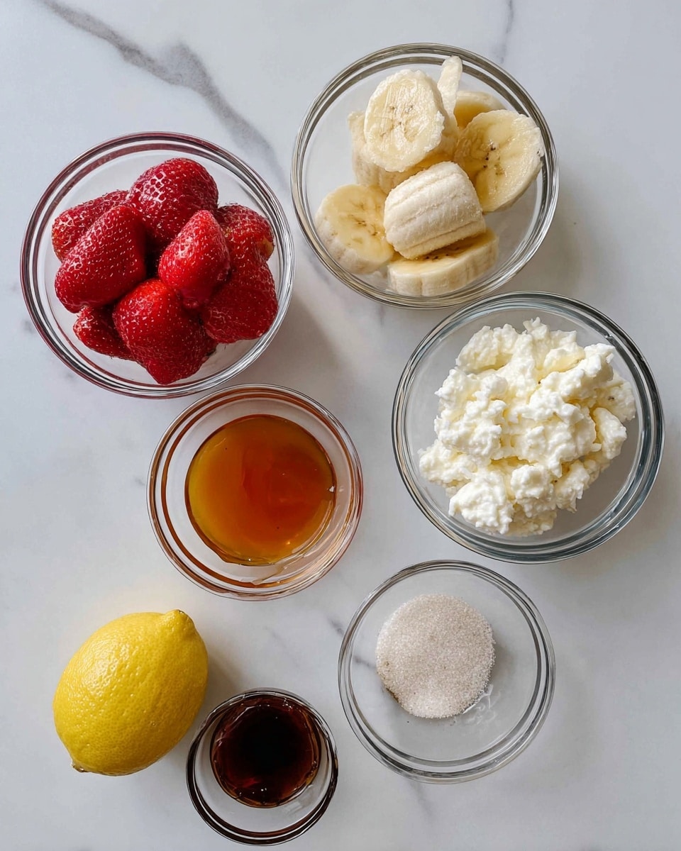 The image shows five small round clear glass bowls placed on a white marbled surface. The top right bowl contains sliced light yellow bananas with a sugar-like texture sprinkled on top. Below it, to the right, is another bowl filled with white cottage cheese with a soft, grainy texture. At the bottom left, a bowl holds orange honey with a smooth and thick appearance, while above it, another bowl contains dark brown vanilla extract with a glossy surface. On the left side, a bowl is filled with whole bright red strawberries with seeds visible on their surface. A half lemon with a textured, light yellow peel and a juicy interior is placed near the bottom center of the image. Photo taken with an iphone --ar 4:5 --v 7