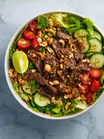 Sesame Ginger Steak Salad with Grape Tomatoes, Crispy Fried Onions & Peanuts Recipe