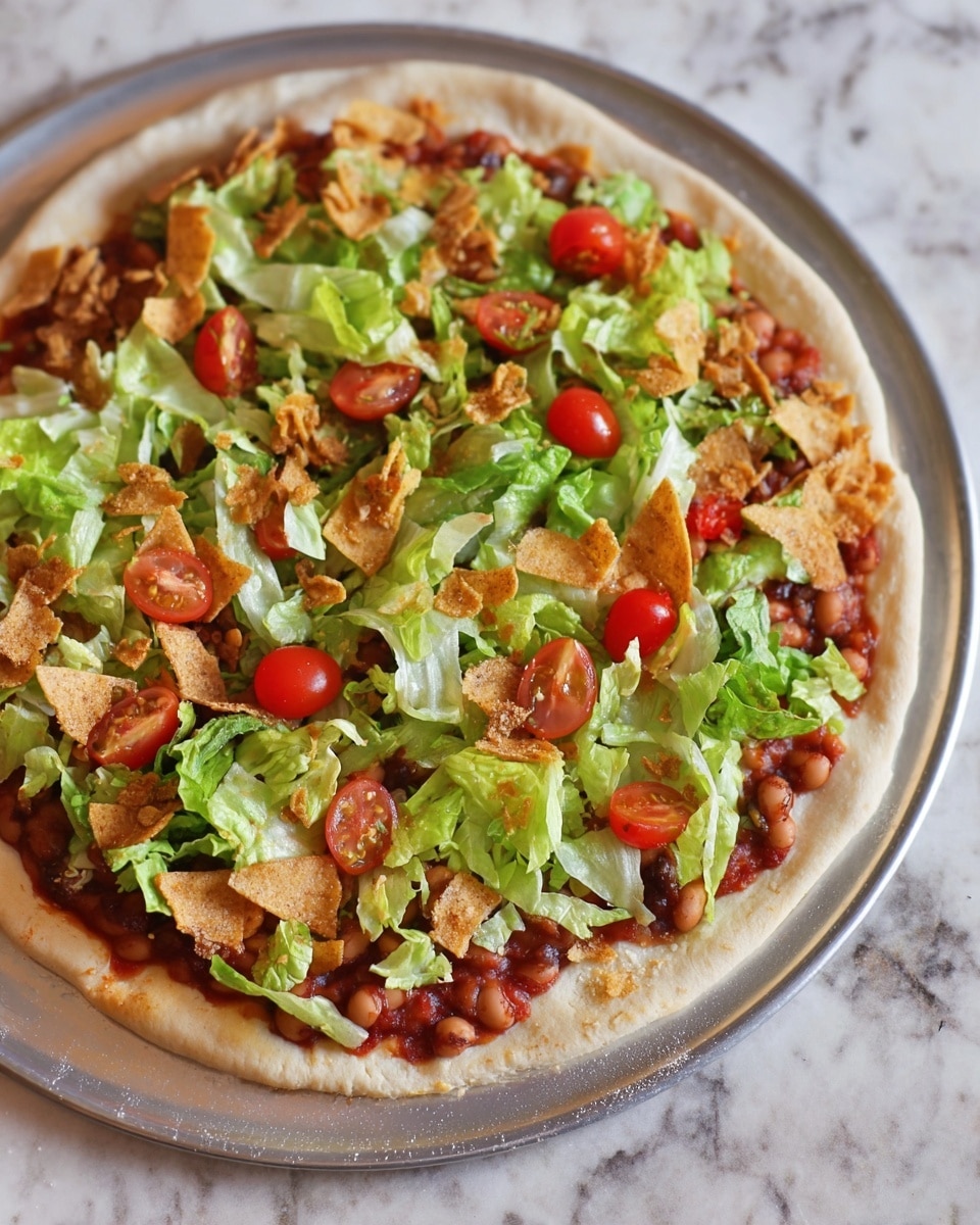 A pizza on a round silver tray with a white soft crust base layer topped with a thin red tomato sauce layer, followed by a layer of small brown beans spread evenly. On top, there is a layer of fresh green lettuce pieces and bright red halved cherry tomatoes scattered around. The final layer consists of light brown broken crispy chips sprinkled over the vegetables. The tray is placed on a white marbled surface. photo taken with an iphone --ar 4:5 --v 7