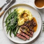 Rib-Eye Steak Over Truffled Mashed Potatoes with Green Beans Amandine Recipe