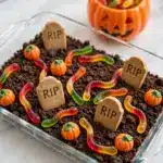 Halloween Sheet Cake with Gummy Worms, Candy Corn Pumpkins, and Risqué "RIP" Cookies Recipe